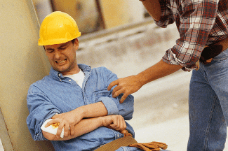 Construction man holding injured arm - construction accident