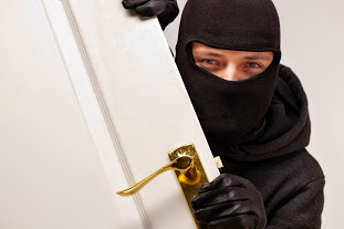 The Consequences of Inadequate Security: burglar breaking into home