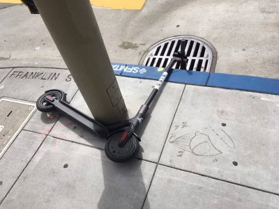 Bird scooter laying improperly on the street - bird scooter accident