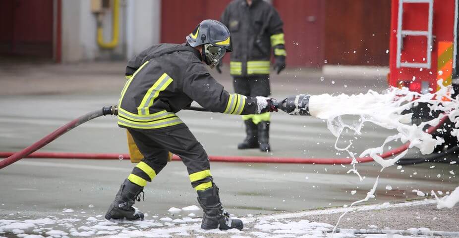 Fireman with fire hose - foam