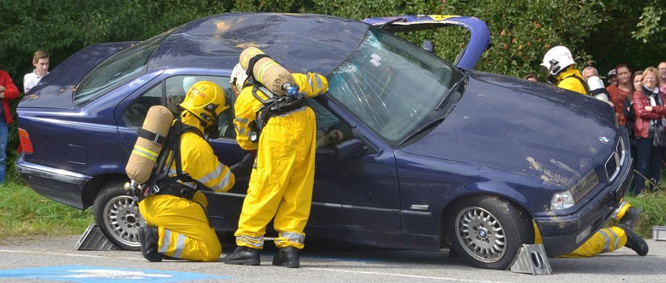 Firefighters at the scene of a car accident