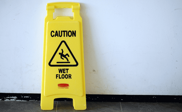 Yellow "Caution Wet Floor" Slip and Fall sign