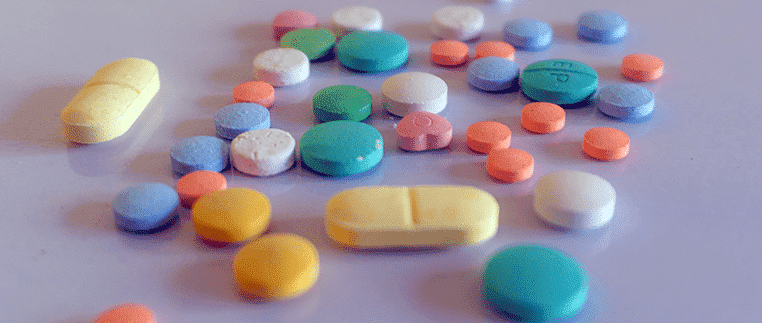 Serotonin Syndrome Lawsuits - colorful pills spilled out on table