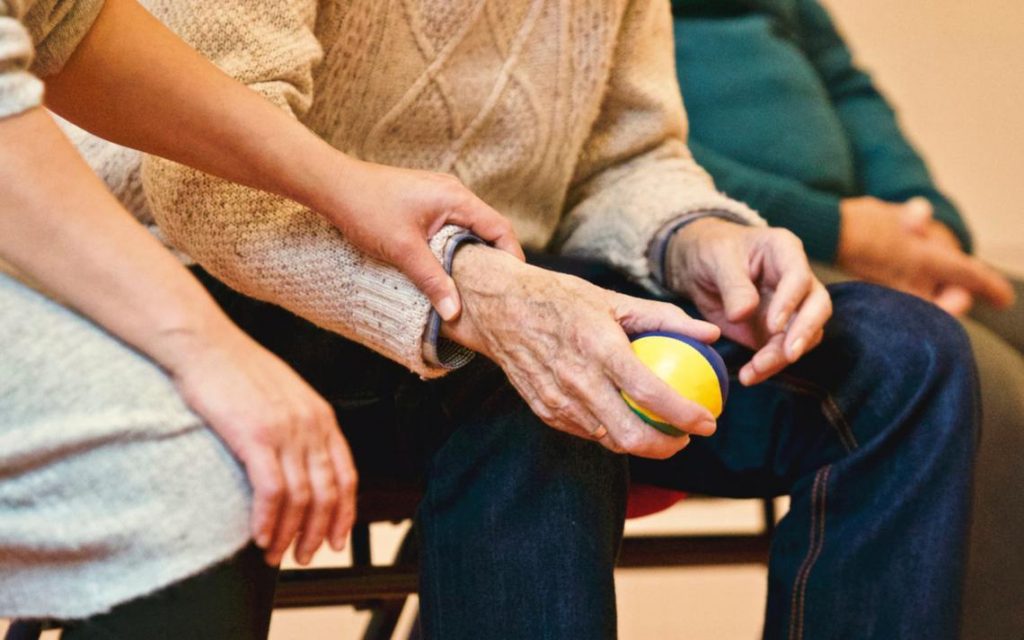 old man holding squish ball - suing nursing home for covid death