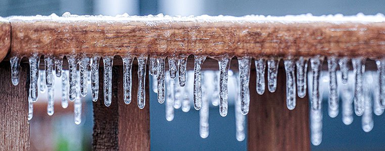 Image of icicles hanging from a wood platform - TX power outage
