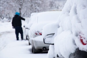 Cars parked covered in snow after a texas power outage.