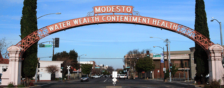 Sign that reads: "Modesto Water Walth Contentment Health"