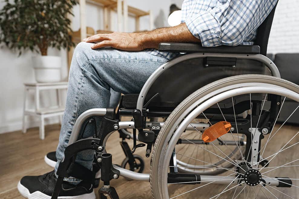 Man sitting in wheelchair in hospital after an accident
