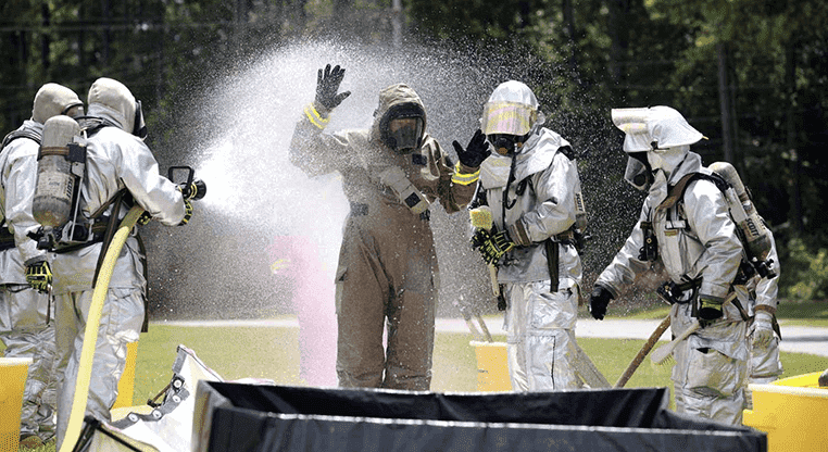 people in hazmat suits due to toxic exposure