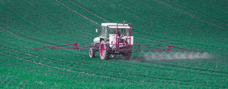 Chlorpyrifos pesticide - field with tractor