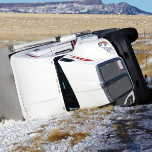 Semi truck on its side after truck accident