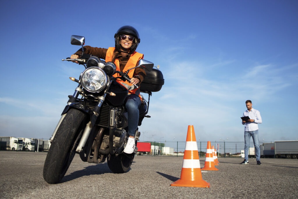 A motorcycle ridertaking their vehicle for a test ride in motorcycle school.