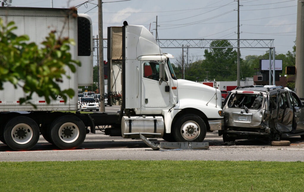 Truck slamming into a car in a broadside collision.