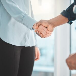 An injured man and a professional shaking hands.