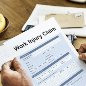 A piece of paper reading "Work Injury Claim."